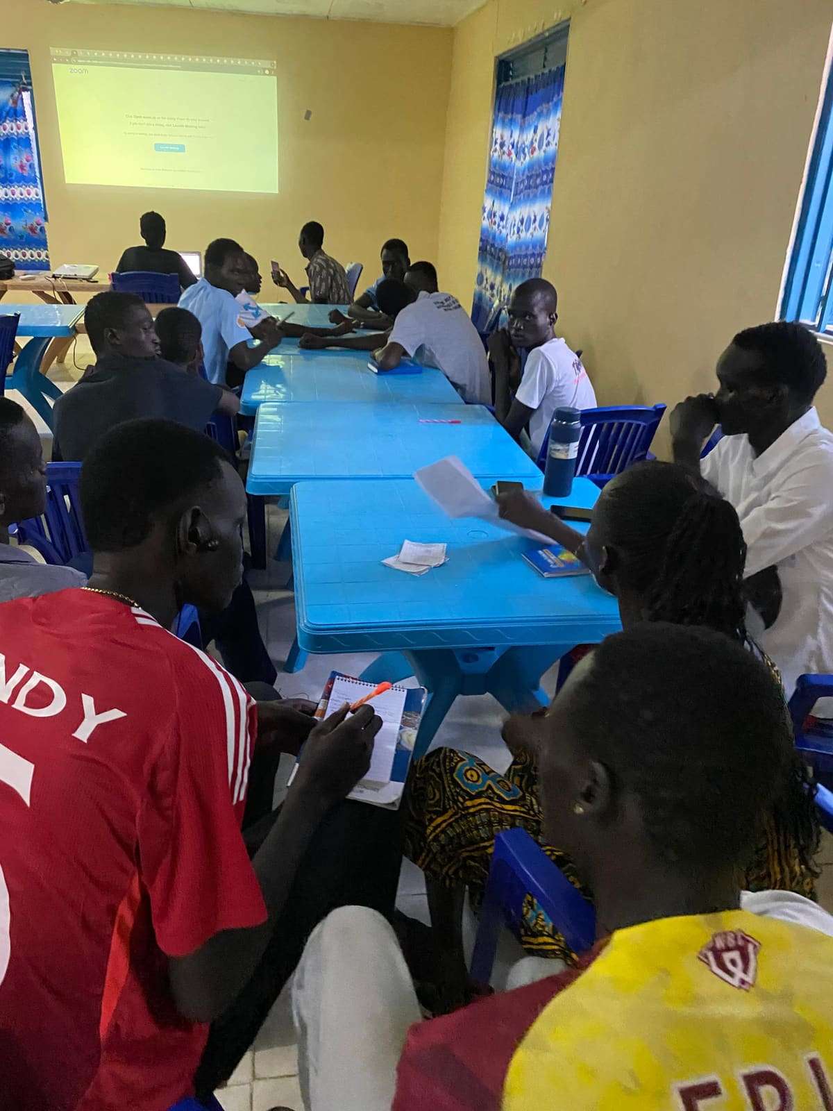 Participants listening at a workshop